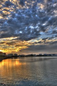 Preview wallpaper coast, clouds, city, morning, road, structures