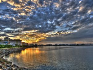 Preview wallpaper coast, clouds, city, morning, road, structures