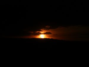 Preview wallpaper coast, clouds, sea, sunset, dark