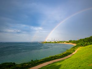 Preview wallpaper coast, field, water, rainbow, landscape
