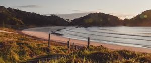 Preview wallpaper coast, hills, sea, stairs, grass, sky