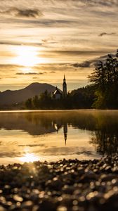Preview wallpaper coast, lake, reflection, towers, twilight