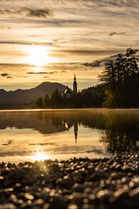 Preview wallpaper coast, lake, reflection, towers, twilight