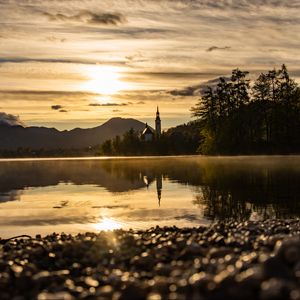 Preview wallpaper coast, lake, reflection, towers, twilight