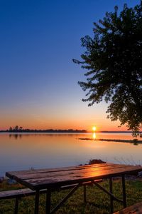 Preview wallpaper coast, lake, tree, table, benches, evening, decline, romanticism