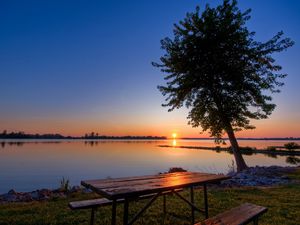 Preview wallpaper coast, lake, tree, table, benches, evening, decline, romanticism