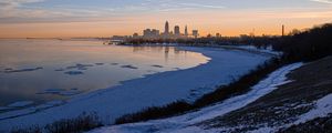 Preview wallpaper coast, lake, winter, snow, city, sunrise