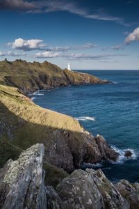 Preview wallpaper coast, lighthouse, rocks, sea