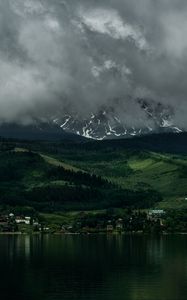 Preview wallpaper coast, mountains, buildings, fog