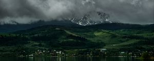 Preview wallpaper coast, mountains, buildings, fog