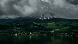 Preview wallpaper coast, mountains, buildings, fog