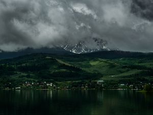 Preview wallpaper coast, mountains, buildings, fog