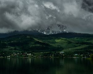Preview wallpaper coast, mountains, buildings, fog