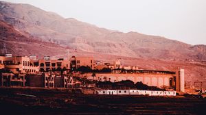 Preview wallpaper coast, mountains, buildings, architecture
