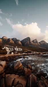 Preview wallpaper coast, mountains, rocks, water, buildings