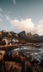 Preview wallpaper coast, mountains, rocks, water, buildings