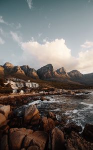 Preview wallpaper coast, mountains, rocks, water, buildings