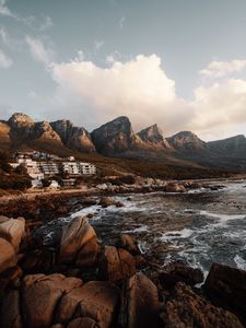 Preview wallpaper coast, mountains, rocks, water, buildings