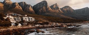 Preview wallpaper coast, mountains, rocks, water, buildings