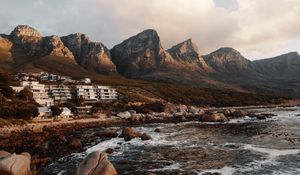 Preview wallpaper coast, mountains, rocks, water, buildings