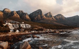 Preview wallpaper coast, mountains, rocks, water, buildings