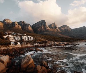 Preview wallpaper coast, mountains, rocks, water, buildings