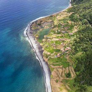Preview wallpaper coast, ocean, houses, aerial view, forest, road