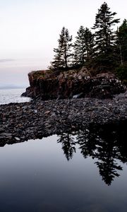 Preview wallpaper coast, pebbles, rock, trees