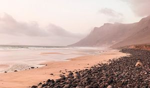 Preview wallpaper coast, pebbles, rocks, sea