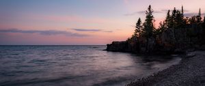 Preview wallpaper coast, pebbles, sea, trees, twilight