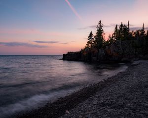 Preview wallpaper coast, pebbles, sea, trees, twilight