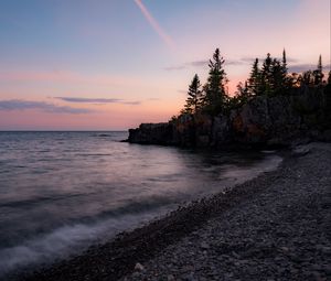Preview wallpaper coast, pebbles, sea, trees, twilight