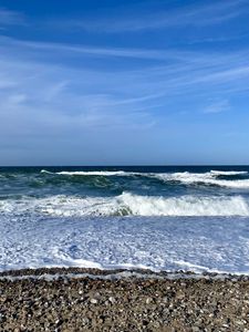 Preview wallpaper coast, pebbles, sea, waves, foam, nature
