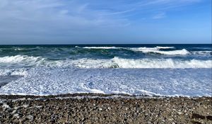 Preview wallpaper coast, pebbles, sea, waves, foam, nature