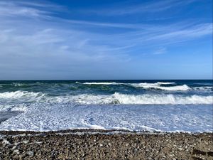 Preview wallpaper coast, pebbles, sea, waves, foam, nature
