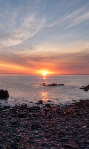 Preview wallpaper coast, pebbles, stones, sea, sunset