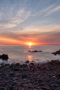 Preview wallpaper coast, pebbles, stones, sea, sunset