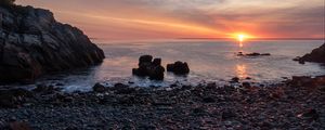 Preview wallpaper coast, pebbles, stones, sea, sunset