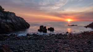 Preview wallpaper coast, pebbles, stones, sea, sunset