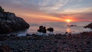 Preview wallpaper coast, pebbles, stones, sea, sunset