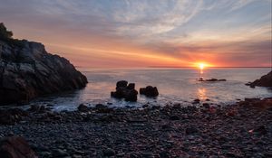 Preview wallpaper coast, pebbles, stones, sea, sunset