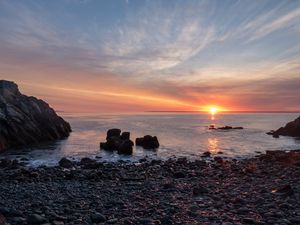 Preview wallpaper coast, pebbles, stones, sea, sunset