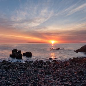 Preview wallpaper coast, pebbles, stones, sea, sunset