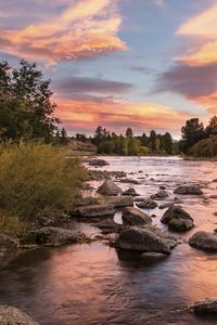 Preview wallpaper coast, river, stones, sunset, nature, landscape