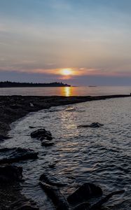 Preview wallpaper coast, river, stones, sunset, twilight, horizon