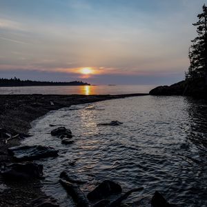 Preview wallpaper coast, river, stones, sunset, twilight, horizon