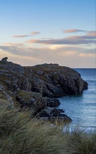 Preview wallpaper coast, rock, cliff, sea, grass, nature