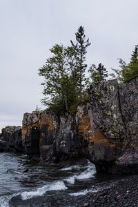 Preview wallpaper coast, rock, trees, sea, pebbles, nature