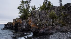 Preview wallpaper coast, rock, trees, sea, pebbles, nature