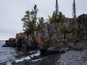 Preview wallpaper coast, rock, trees, sea, pebbles, nature